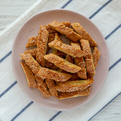 Homemade Italian Cantuccini with Pistachios and Citron on a Plate, top view. Crispy Pistachio and Citron Cookies. Close-up.