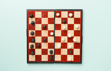 Chess on color background, top view