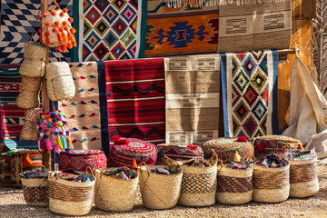 Siwa oasis, Egypt - January 2022: Traditional handmade oriental carpets in a souvenir shop in Siwa oasis near Cleopatra's Pool  - obrazy, fototapety, plakaty
