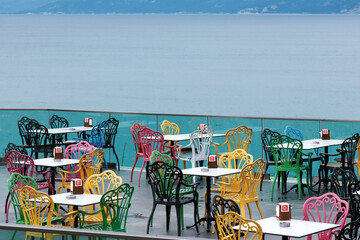 Empty cafe with Mediterranean Sea view on cloudy morning. Antalya, Turkey.