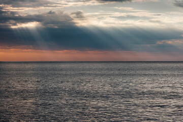 Fototapeta premium Sunbeams above Mediterranean Sea at sunrise. Beydaglari Coastal National Park, Antalya Province, Turkey.