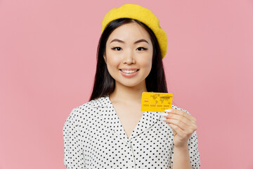 Young smiling happy cheerful woman of Asian ethnicity 20s wear white polka dot t-shirt yellow beret...