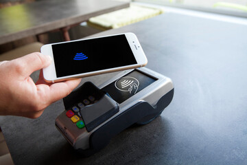 Woman paying with her smartphone.