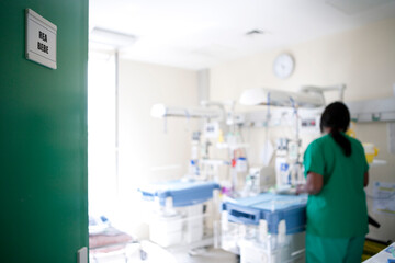 Newborn resuscitation in the maternity ward of a hospital. - obrazy, fototapety, plakaty
