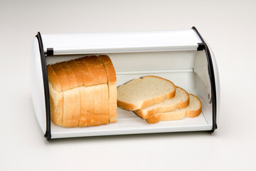 White metal bread box with bread inside, isolated