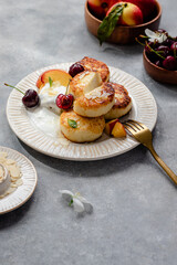 cheese pancakes with cherry, nectarine, yougurt.  breakfast table