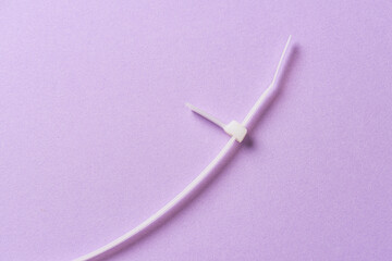 Cut up white plastic cable tie.