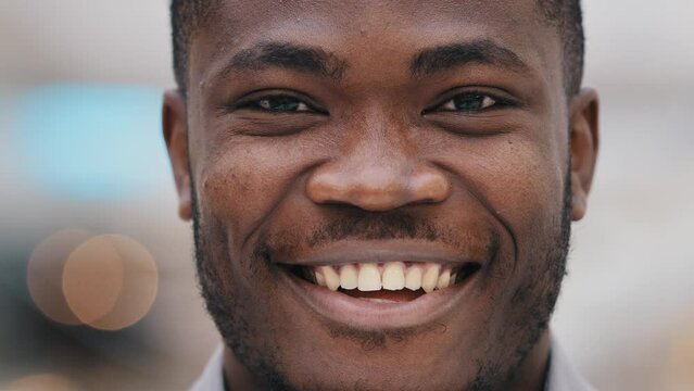 Headshot young happy positive african american businessman company representative looking at camera feeling confident showing perfect healthy toothy smile advertising dental procedure male portrait