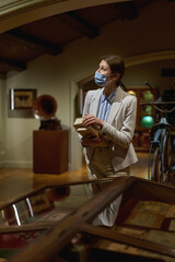 women in the museum looks at art exhibitions.