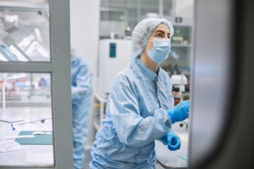 Women work in the lab. Conducts experiments on vaccines.