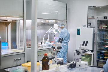 Women work in the lab. Conducts experiments on vaccines.
