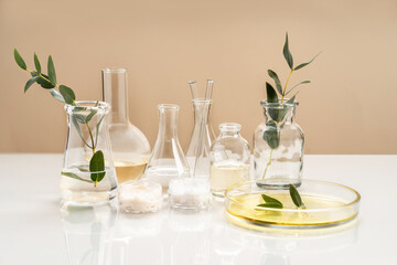 Alternative natural medicine and glassware, flasks and petri bowl. Alternative medicine herbs. Natural beauty skin care products. Concept research and development.