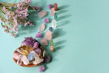 minerals set and flowers on green background. Gemstones for Healing Crystal Ritual, esoteric...