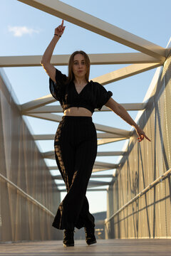 Professional Dancer Dancing Waacking Urban Dance At Sunset On The Street. Vertical Portrait