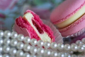 Obraz na płótnie Canvas Princess sweets / pink Macarons and pearls appetizing sweets / dessert/ natural light