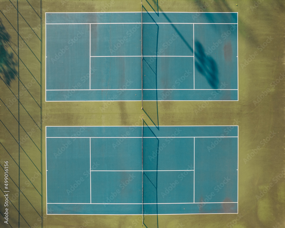 Wall mural two tennis courts from an aerial view