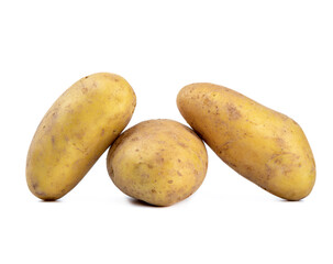 Three tubers of unpeeled raw potatoes on a white background.