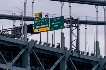 Road signs on the upper level of the Verrazano Narrows Bridge between Brooklyn and Staten Island,...