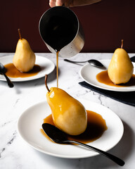 Poached pears with a caramel sauce