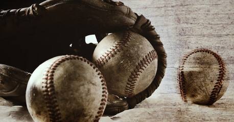 Old vintage wood texture over baseball balls with glove.