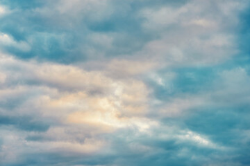 Nature background pastel sky covered with clouds before sunset