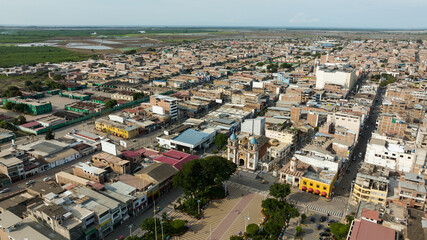 Fototapeta premium Aerial shot of the main park, church and city of Tumbes, Peru