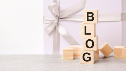Blog text on a wooden cubes on a white paper background