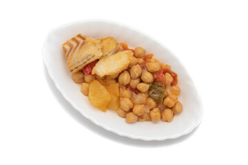 Food widely consumed at Easter, in Spain, chickpeas with cod. Isolated on white background. Spanish traditional foods.