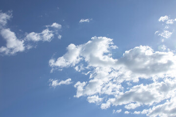 A blue sky with white clouds, as a background.