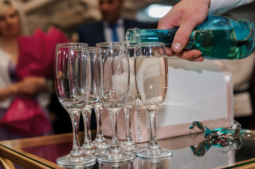 Glasses of white sparkling wine on the table. serving wine
