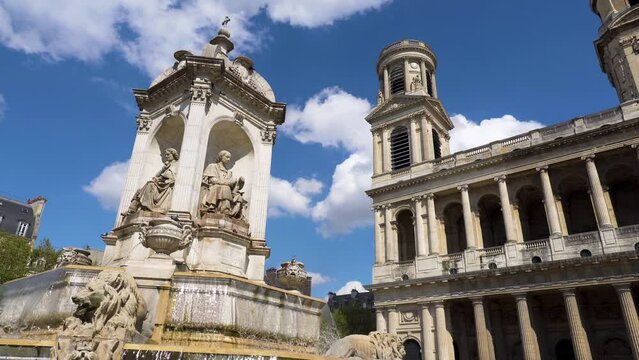 Fountain of Saint-Sulpice on a sunny day with the Church of Saint-Sulpice in the background - Paris, France