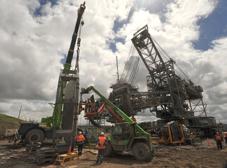 Dredge maintenance-replacing bucket wheel on site Yallourn opencut coal mine