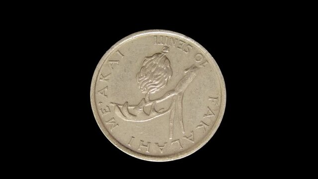 Rotating of Tonga coin 10 seniti minted from 1981 till 2005. Isolated on black background.