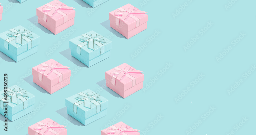 Wall mural Minimal composition background of pastel pink and blue Christmas gift box. New Year concept.