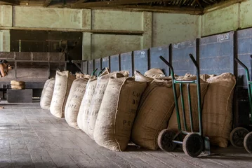 Deurstickers Chocolate grain bags at warehouse © Paulo Esteves