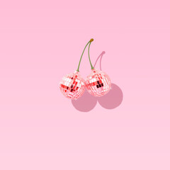Decorate disco balls like cherries. The concept of minimal entertainment. Flat lai. - obrazy, fototapety, plakaty