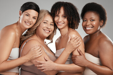 Love and support runs deep here. Shot of a diverse group of women standing and hugging each other in the studio.