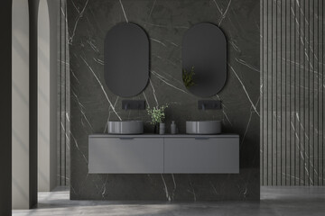 Dark bathroom interior with concrete floor, double sink and oval mirror, front view. Minimalist black bathroom with modern furniture. 3d rendering
