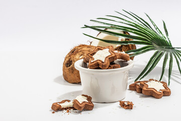 Gluten-free and lactose-free coconut cookies. Homemade healthy pastries, green tea, sunny morning