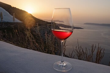 Glass of a rose wine on sunset