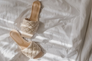 Modern feminine beige color summer sandals - obrazy, fototapety, plakaty