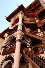 Fototapeta na wymiar The architecture of the residential part of Rila Monastery: many stairways