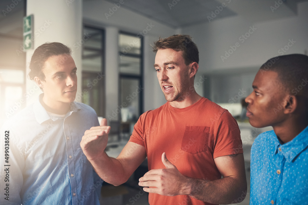 Poster expanding their goals for a greater success. shot of three colleagues having a discussion in an offi