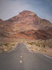 Lonely Death Valley road wanders in the desert