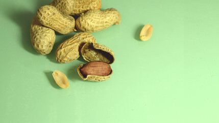 A group of peanuts highlighted on a green background