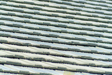 selective focus of gray roof tiles in sun