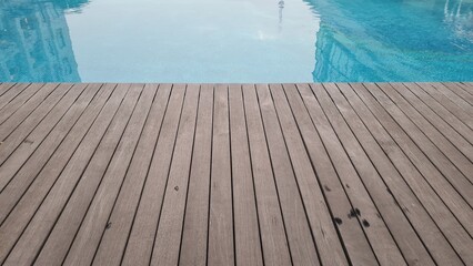 Wooden floor in the pool. wooden platform on swimming pool background