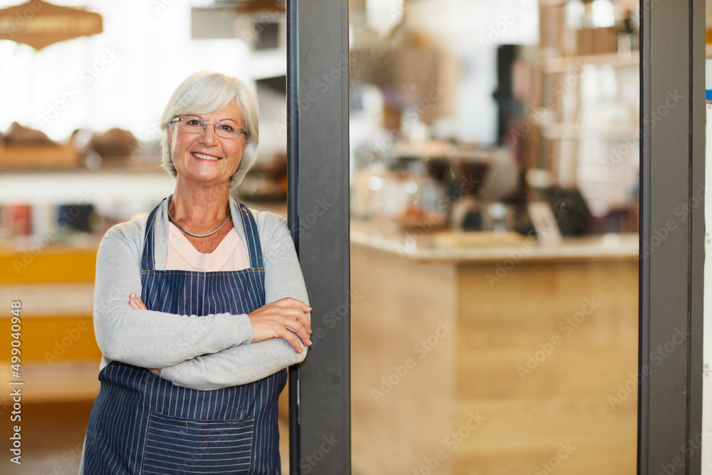 Canvas Prints Welcoming customers with a smile. Portrait of a happy senior business owner posing with her arms crossed in her coffee shop.