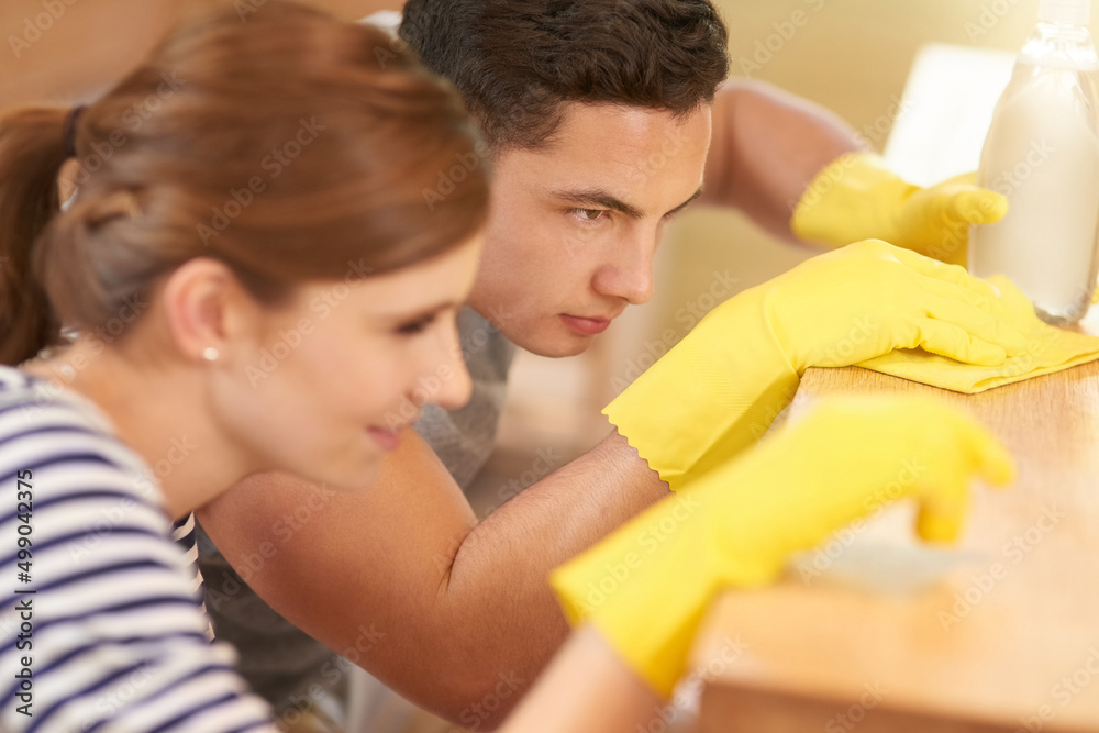 Canvas Prints theyve perfected cleaning to an art. shot of a happy young couple cleaning their kitchen together.