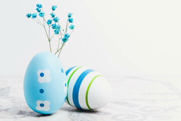 Easter. Multicolored eggs. Yellow and blue Easter decorations.